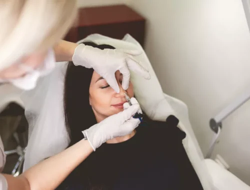 Aesthetic practitioner injecting dermal filler into a patient's nose during non-surgical rhinoplasty at Navaa, Mumbai
