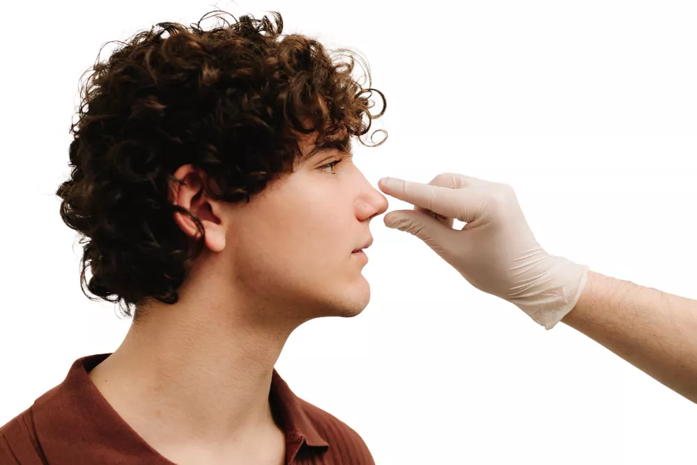 Man's facial profile considering rhinoplasty at Navaa, Mumbai